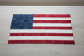 Brave and True Charm Pack — fabric squares arranged in American flag pattern