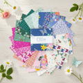 Chloe Charm Pack lifestyle photo — garden party styling with butterflies and florals